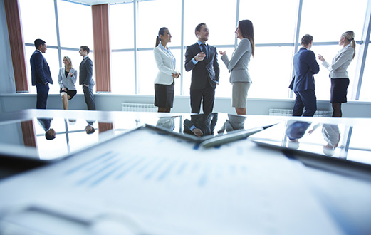 business colleagues having conversation in boardroom