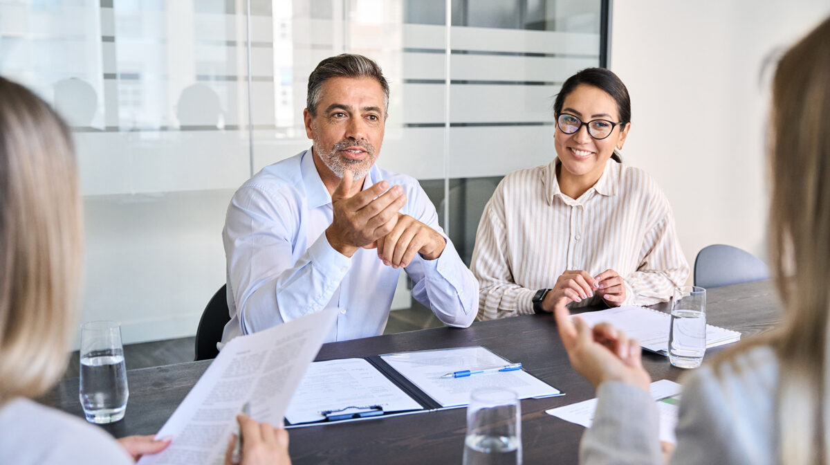 man sitting at table conducting job interview